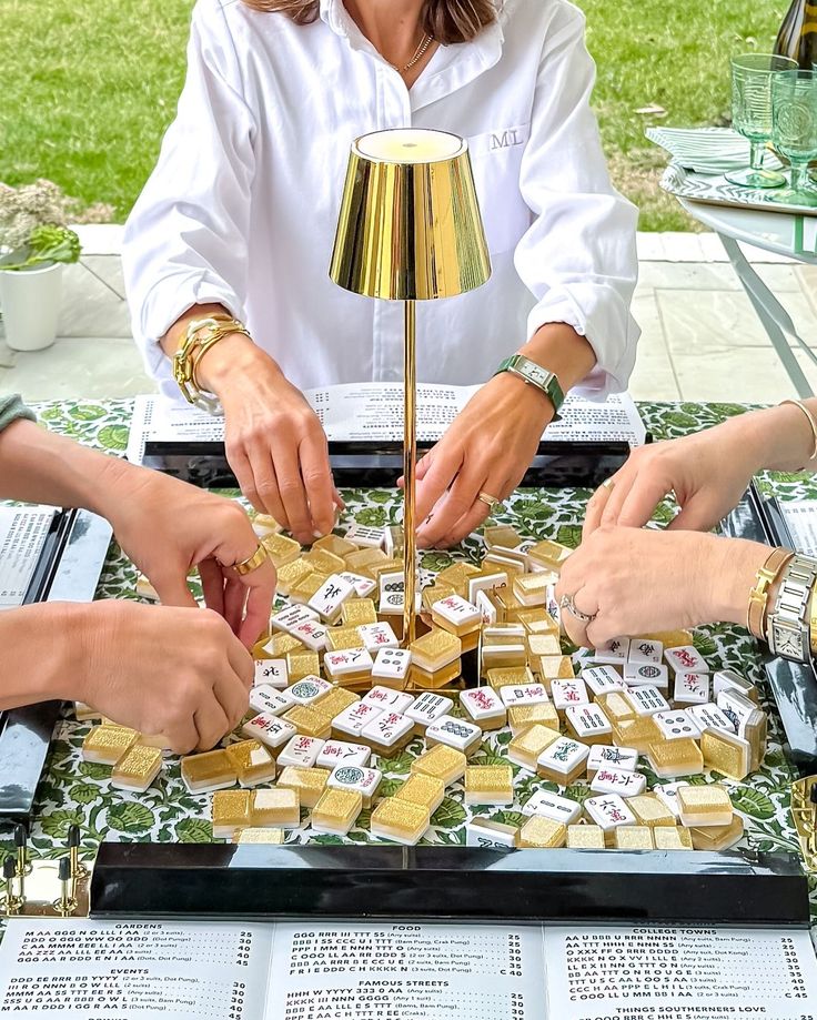 Women playing mahjong outdoors